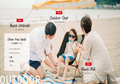 a family sitting in a beach chair on the beach at BbyC Hotel 那覇 レンタカー付ホテル in Naha