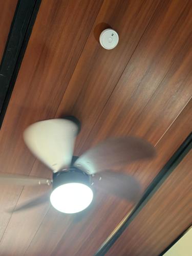 a ceiling fan with a light in a room at Casa Nova at La Escapadita in Esterillos