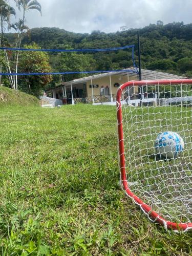a soccer ball is in the net of a field at Finca Villa Carmen, Vía Magdalena in Villeta