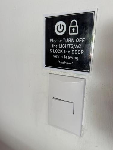 a sign on a wall next to a white box at Casa Nova at La Escapadita in Esterillos