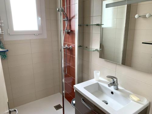 a bathroom with a sink and a shower at Maison rénovée proche plage Port Lin - 5 couchages - Jardin clos - FR-1-843-32 in Le Croisic