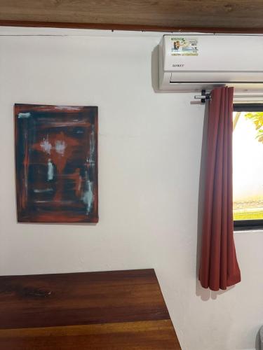 a room with a air conditioner and a window at Casa Nova at La Escapadita in Esterillos