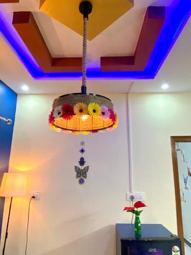 aendant light hanging from a ceiling in a room at Villa De Dunes 369, Orchid Home in Bengaluru