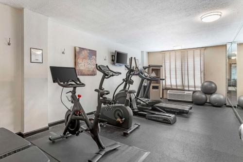 a gym with two treadmills and two exercise bikes at Best Western Plus Grosvenor Airport Hotel in South San Francisco