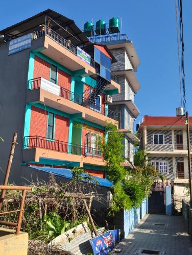 a building with balconies on the side of it at Harry Guest House & Restaurant in Pokhara