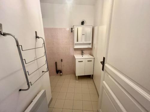 a small bathroom with a sink and a mirror at Salon de Provence in Salon-de-Provence