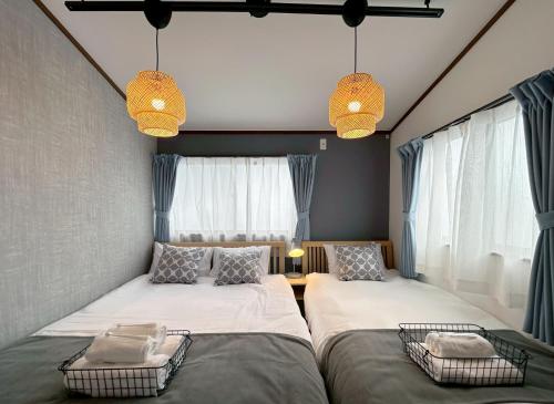 Ένα ή περισσότερα κρεβάτια σε δωμάτιο στο Villa Kyoto Uzumasa East