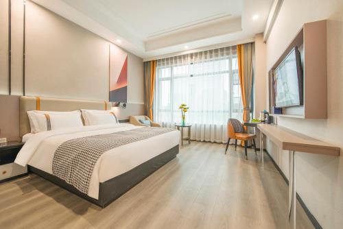 Voodi või voodid majutusasutuse Xiyueliang Hotel Kunming South Asian Style First City Branch toas