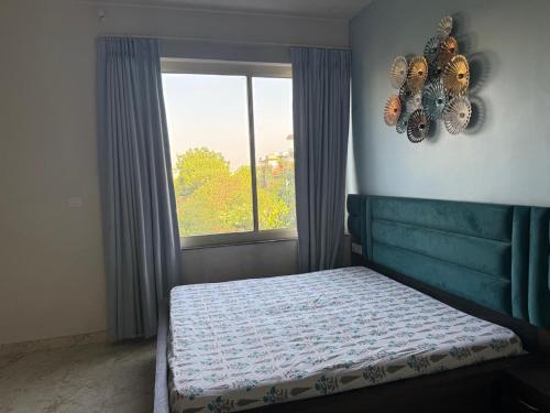 Una cama o camas en una habitación de Blush Bungalow