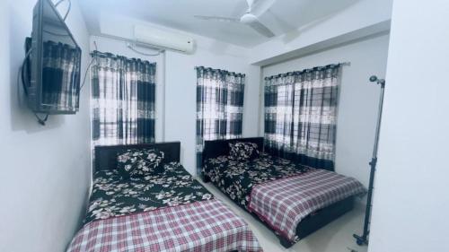 Appayan Guest House Dhakaにあるベッド