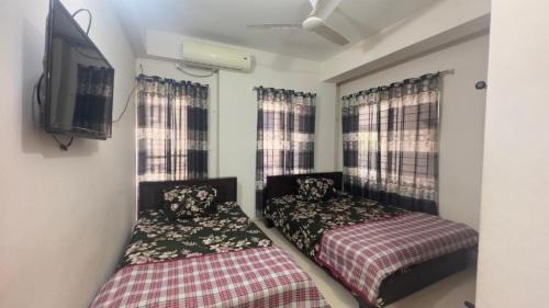 Appayan Guest House Dhakaにあるベッド