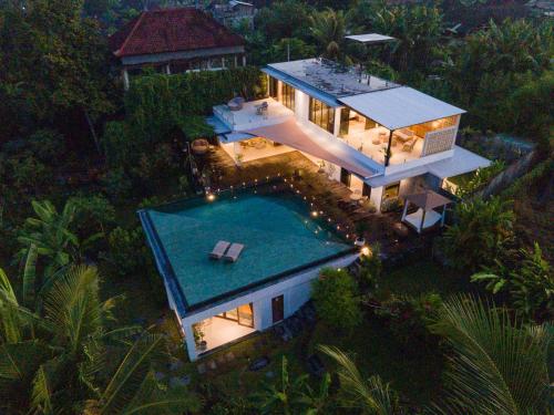 an aerial view of a house with a swimming pool at IBU The Sanctuary by OXO in Ubud