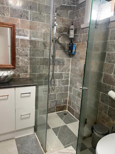 a shower with a glass door in a bathroom at Home in Laverton 19 Minutes to Melbourne CBD in Laverton