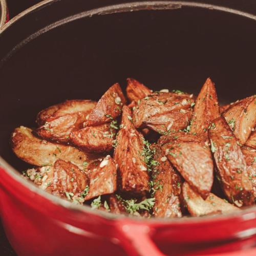 a pot filled withairedairedaired food in a red bowl at Fairfield by Marriott South Binh Duong in Thuan An