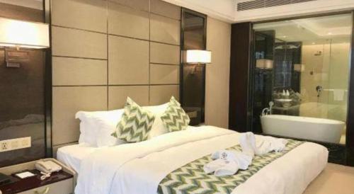 Postel nebo postele na pokoji v ubytování Enping Yucca Hotel