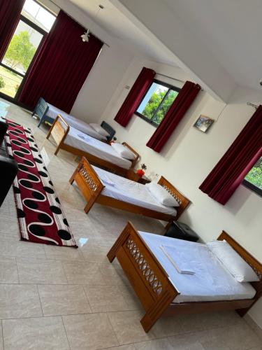 Llit o llits en una habitació de Hotel & Hostel Relax