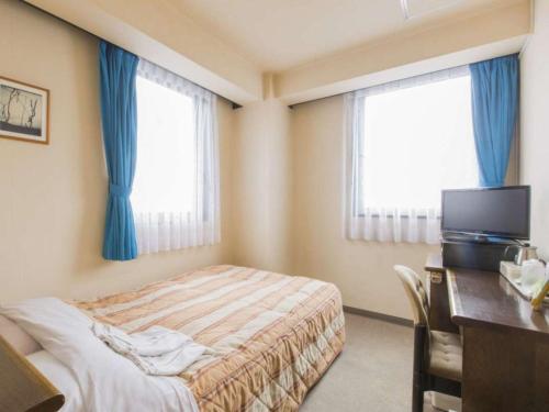 Postel nebo postele na pokoji v ubytování Hotel New Neo