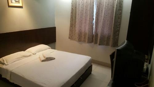 Tiong Nam Hotelにあるベッド