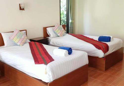 เตียงในห้องที่ OYA International Resort Phuket 普吉岛欧雅国际度假酒店