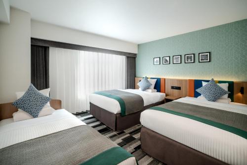 Ένα ή περισσότερα κρεβάτια σε δωμάτιο στο HOTEL MYSTAYS Fukuoka Tenjin Minami