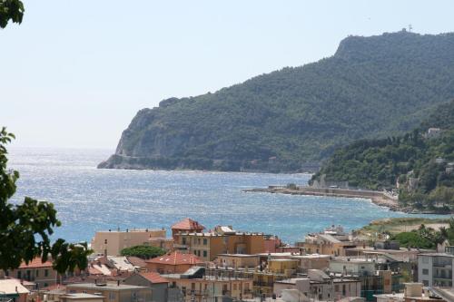 a group of buildings next to a body of water at B&B Ai Tre Archi in Spotorno