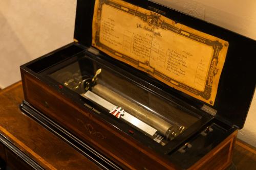 a wooden box with a sign in it on a table at Kyotoya in Takeo