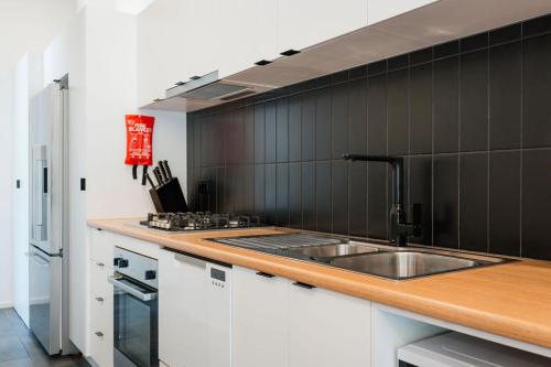 a kitchen with a sink and a counter top at BIG4 Yarra Valley Park Lane Holiday Park in Healesville