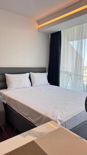 Ένα ή περισσότερα κρεβάτια σε δωμάτιο στο Grand Sapphire Luxury Residence