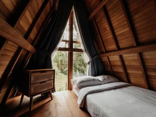 Ένα ή περισσότερα κρεβάτια σε δωμάτιο στο Sandan natural farm stay