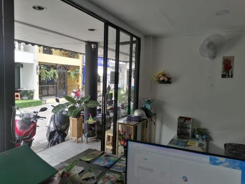 an office with a desk with a computer and a window at Patong Beach Dream House in Patong Beach