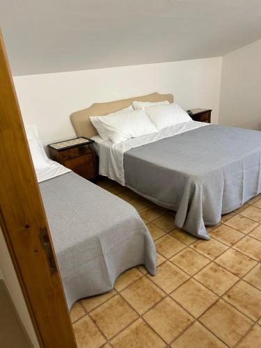Ένα ή περισσότερα κρεβάτια σε δωμάτιο στο Villa Italia