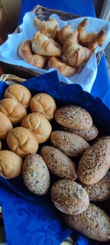 a bunch of bagels and pastries on a table at Landgasthaus Backhof-Helmle in Breitnau