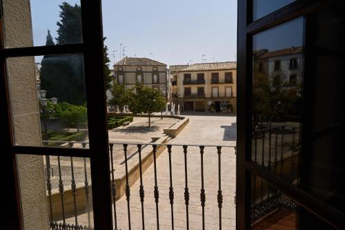 a view of a courtyard from a window at Hotel María de Molina in Úbeda