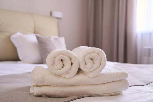 Ένα ή περισσότερα κρεβάτια σε δωμάτιο στο Apart-Hotel Kareff
