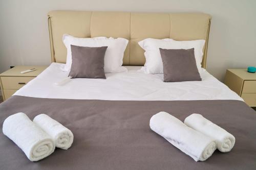 Ένα ή περισσότερα κρεβάτια σε δωμάτιο στο Apart-Hotel Kareff