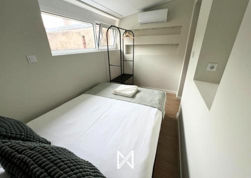 Ένα ή περισσότερα κρεβάτια σε δωμάτιο στο MyStay - Gaia Garden
