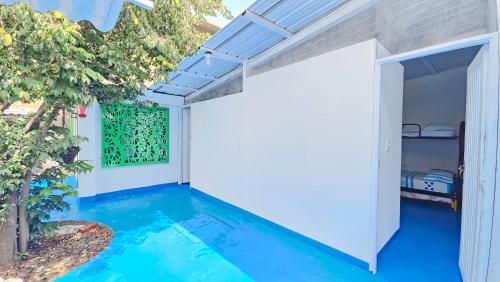 a swimming pool in the middle of a house at Mom's house Colombia in Cali