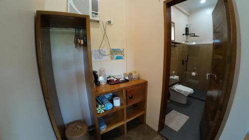a bathroom with a shower and a sink and a toilet at Yapak Beach Villas in San Isidro