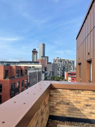 a view of the city from the roof of a building at Cozy flat Near Manchester - Private double room with WiFi in Manchester