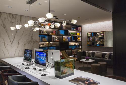 a room with a desk with two computers on it at Hyatt Centric Chicago Magnificent Mile in Chicago