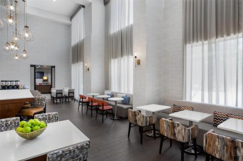 a dining room with tables and chairs at Hampton Inn & Suites Dallas-Arlington North-Entertainment District in Arlington