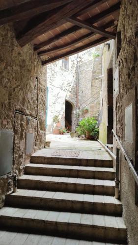 a group of stairs in a stone building at Casa Vacanze Uno Sguardo Sul Borgo in Montecatini Val di Cecina