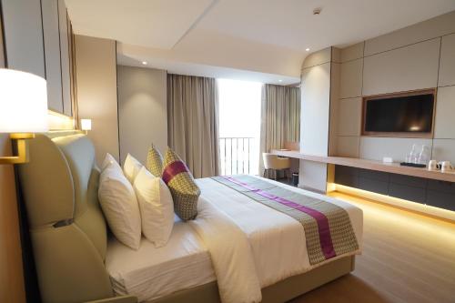Ένα ή περισσότερα κρεβάτια σε δωμάτιο στο Orchid Hotel Chandigarh,Zirakpur