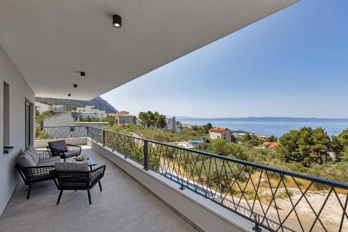 a balcony with a view of the ocean at Villa Solas Lux Makarska - Veliko Brdo in Veliko Brdo