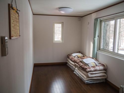 A bed or beds in a room at Guesthouse Canterbury