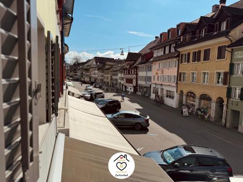 a view of a city street with cars parked at Family M Apartments 16-17-18 in Sempach