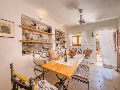 a dining room with a wooden table and chairs at Villa Sunce in Hvar
