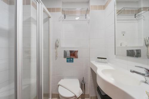 Koupelna v ubytování Arte Hotel