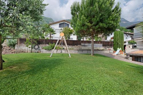 a easel in the yard of a house at Seaberhof Kaltern in Caldaro