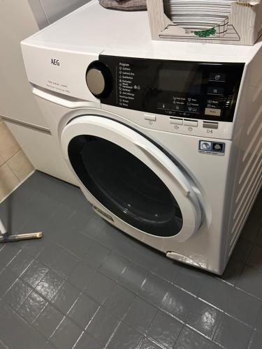 a white microwave oven sitting on top of a counter at Harmonia2 in Keminmaa